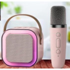 Karaoke skaļrunis ar mikrofonu rozā krāsā